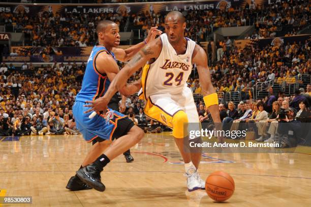 Kobe Bryant of the Los Angeles Lakers drives past Russell Westbrook of the Oklahoma City Thunder in Game One of the Western Conference Quarterfinals...
