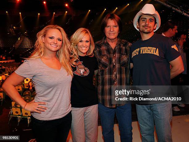 Musician Miranda Lambert, singer Carrie Underwood, musician John Fogerty and musician Brad Paisley backstage at the 45th Annual Academy of Country...