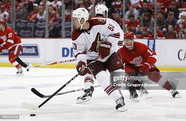 Derek Morris of the Phoenix Coyotes tuns up ice in front of Dan Cleary the Detroit Red Wings during Game Three of the Western Conference...
