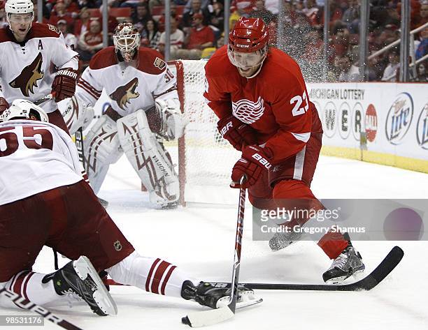 Brad Stuart of the Detroit Red Wings tries to get around the skate of Ed Jovanovski of the Phoenix Coyotes during Game Three of the Western...