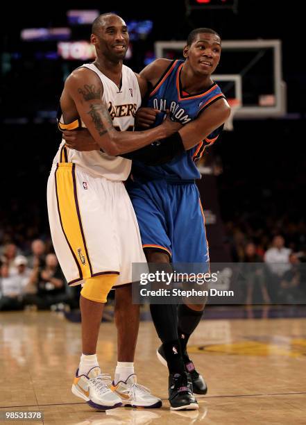 Kobe Bryant of the Los Angeles Lakers and Kevin Durant of the Oklahoma City Thunder smile as they jostle for position during Game One of the Western...