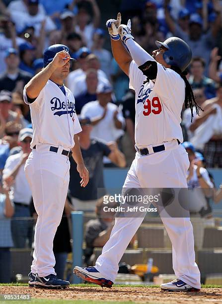 Blake DeWitt and Manny Ramirez of the Los Angeles Dodgers celebrate following Ramirez's two-run homerun in the eighth inning against the San...