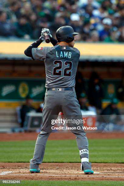 Jake Lamb of the Arizona Diamondbacks at bat against the Oakland Athletics during the second inning at the Oakland Coliseum on May 25, 2018 in...