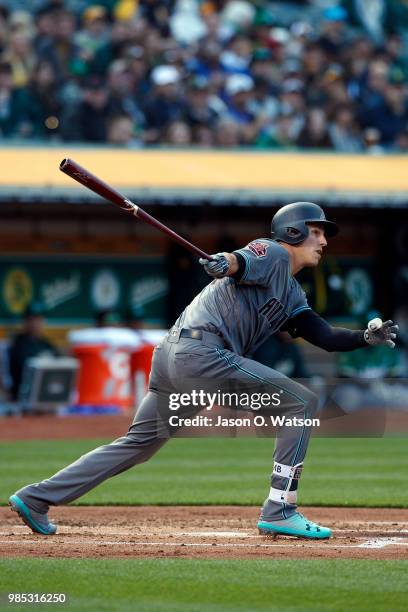 Jake Lamb of the Arizona Diamondbacks at bat against the Oakland Athletics during the second inning at the Oakland Coliseum on May 25, 2018 in...