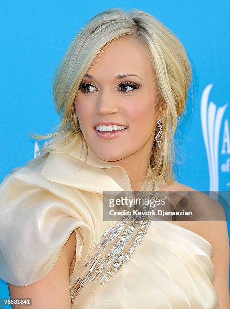 Singer Carrie Underwood signs autographs for fans at the 45th Annual Academy of Country Music Awards at the MGM Grand Garden Arena on April 18, 2010...
