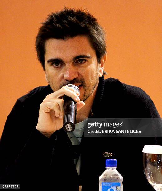 Colombian singer Juanes speaks during a press conference April 18, 2010 in Santo Domingo, to publicize the charity concert "Un canto de esperanza por...