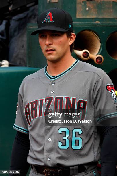 John Ryan Murphy of the Arizona Diamondbacks stands in the dugout before the game against the Oakland Athletics at the Oakland Coliseum on May 25,...