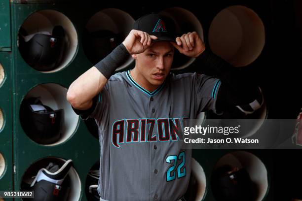 Jake Lamb of the Arizona Diamondbacks stands in the dugout before the game against the Oakland Athletics at the Oakland Coliseum on May 25, 2018 in...