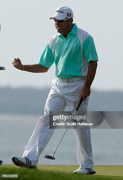 Brian Davis of England celebrates his birdie putt on the 18th green during the final round of the Verizon Heritage at the Harbour Town Golf Links on...