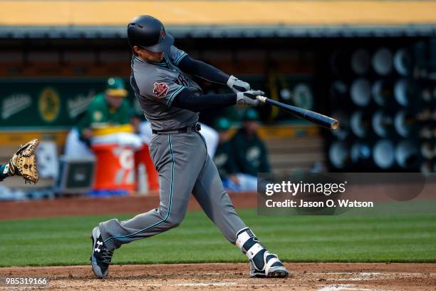 John Ryan Murphy of the Arizona Diamondbacks at bat against the Oakland Athletics during the third inning at the Oakland Coliseum on May 25, 2018 in...