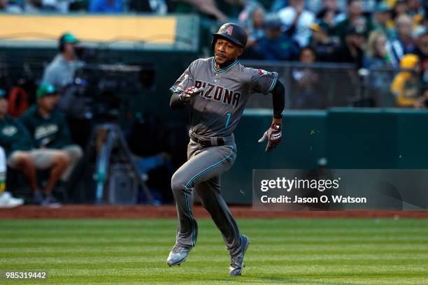 Jarrod Dyson of the Arizona Diamondbacks rounds third base to score a run against the Oakland Athletics during the fourth inning at the Oakland...