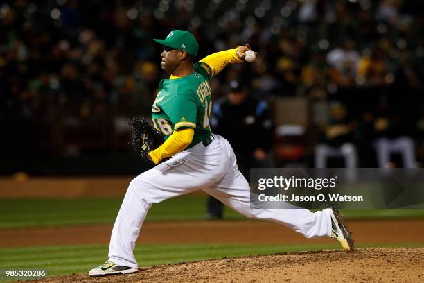 Santiago Casilla of the Oakland Athletics pitches against the Arizona Diamondbacks during the eighth inning at the Oakland Coliseum on May 25, 2018...