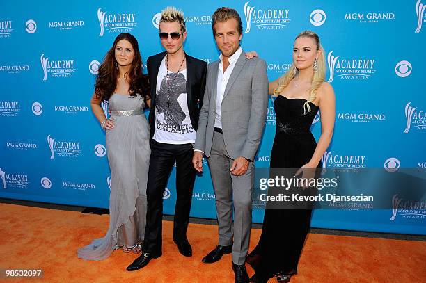 Singers Rachel Reinert, Mike Gossin, Tom Gossin, and Cheyenne Kimball of the band Gloriana arrives for the 45th Annual Academy of Country Music...