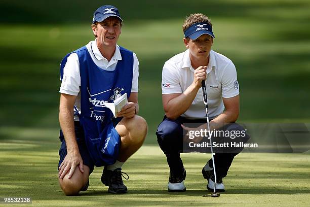 Luke Donald of England waits with his caddie on the 11th green during the final round of the Verizon Heritage at the Harbour Town Golf Links on April...