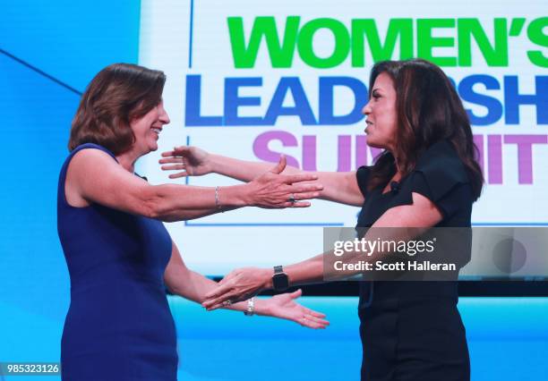 Lynne Doughtie, U.S. Chairman and CEO of KPMG, greets Michele Tafoya of NBC Sports on stage during the KPMG Women's Leadership Summit prior to the...