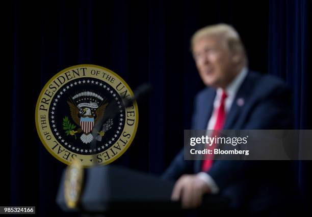 The Presidential seal is displayed while U.S. President Donald Trump speaks during a Face-to-Face With Our Future event in the South Court Auditorium...