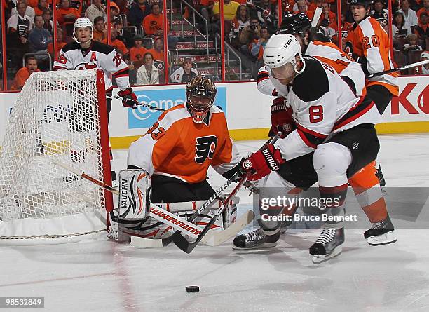 Dainius Zubrus of the New Jersey Devils looks to control a rebound off Brian Boucher of the Philadelphia Flyers in Game Three of the Eastern...