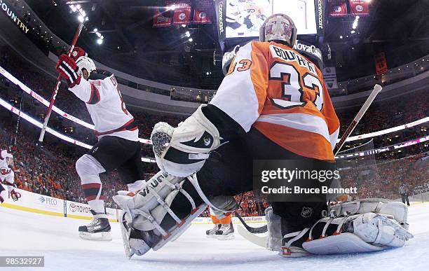 Dainius Zubrus of the New Jersey Devils celebrates a first period goal by Brian Rolston against Brian Boucher of the Philadelphia Flyers in Game...