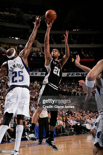 Tim Duncan of the San Antonio Spurs shoots a jumper against Erick Dampier of the Dallas Mavericks in Game One of the Western Conference Quarterfinals...