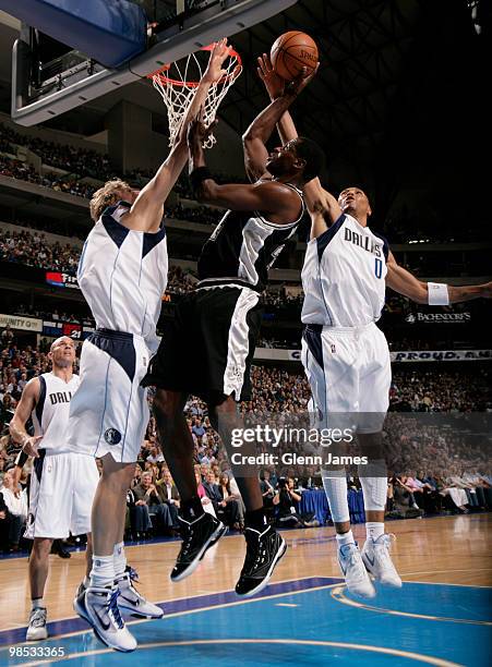 Antonio McDyess of the San Antonio Spurs has his shot blocked by Shawn Marion of the Dallas Mavericks in Game One of the Western Conference...