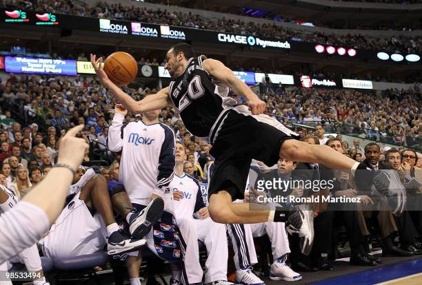 Guard Manu Ginobili of the San Antonio Spurs makes a diving save into the Dallas Mavericks bench in Game One of the Western Conference Quarterfinals...