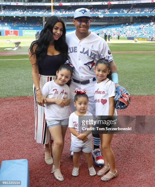 Yangervis Solarte of the Toronto Blue Jays poses with his wife and his daughters on Fathers Day before the start of MLB game action against the...