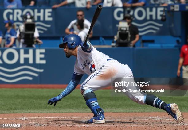 Devon Travis of the Toronto Blue Jays bats in the seventh inning during MLB game action against the Washington Nationals at Rogers Centre on June 17,...