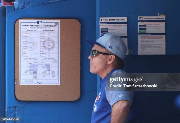Manager John Gibbons of the Toronto Blue Jays looks on from the dugout during MLB game action against the Washington Nationals at Rogers Centre on...