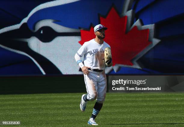 Kevin Pillar of the Toronto Blue Jays jogs off the field after their victory during MLB game action against the Washington Nationals at Rogers Centre...