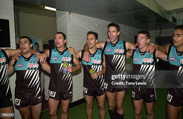 Port Adelaide players sing the club song after winning the match between Port Power and the Western Bulldogs in round 6 of the AFL played at Football...