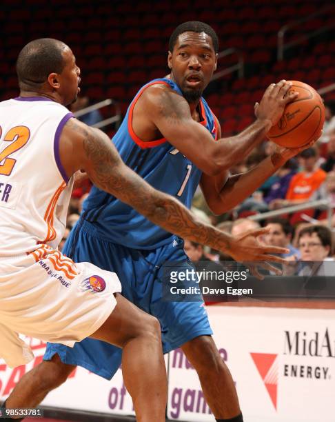Wink Adams of the Tulsa 66ers looks to make a pass around the defense of Jeff Trepagnier from the Iowa Energy in the first half of Game Two of their...