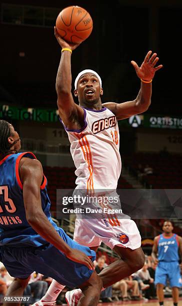 Curtis Stinson of the Iowa Energy lays the ball up while drawing a blocking foul on Larry Owens of the Tulsa 66ers in the second half of Game Two of...