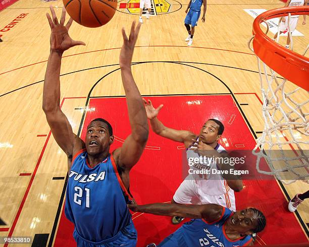 Latavious Williams of the Tulsa 66ers pulls down a rebound in front of Darian Townes of the Iowa Energy in the first half of Game Two of their...