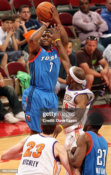 Wink Adams of the Tulsa 66ers spots up for a jumper over Curtis Stinson of the Iowa Energy in the first half of Game Two of their semi-final round...