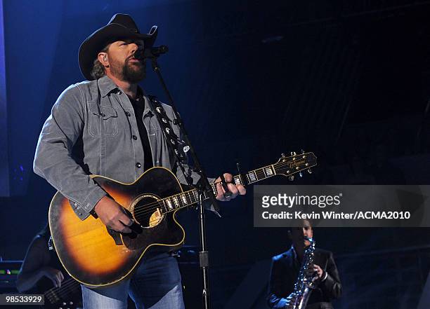 Musicians Toby Keith and Dave Koz perform onstage during the 45th Annual Academy of Country Music Awards at the MGM Grand Garden Arena on April 18,...
