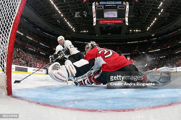 Bill Guerin of the Pittsburgh Penguins dekes Brian Elliott of the Ottawa Senators for a third period goal in Game Three of the Eastern Conference...