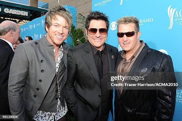 Musicians Joe Don Rooney, Jay DeMarcus and Gary LeVox of the band Rascal Flatts arrive for the 45th Annual Academy of Country Music Awards at the MGM...