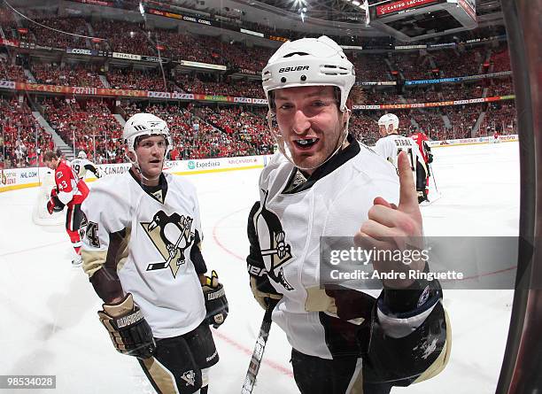 Brooks Orpik of the Pittsburgh Penguins gestures to a fan through the glass after an altercation with the Ottawa Senators in Game Three of the...