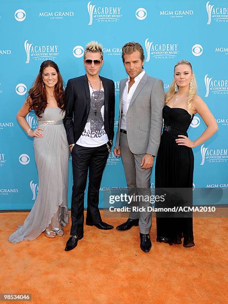 Singers Rachel Reinert, Mike Gossin, Tom Gossin, and Cheyenne Kimball of the band Gloriana arrive for the 45th Annual Academy of Country Music Awards...