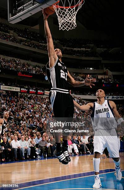 Tim Duncan of the San Antonio Spurs goes in for the layup against Shawn Marion of the Dallas Mavericks in Game One of the Western Conference...