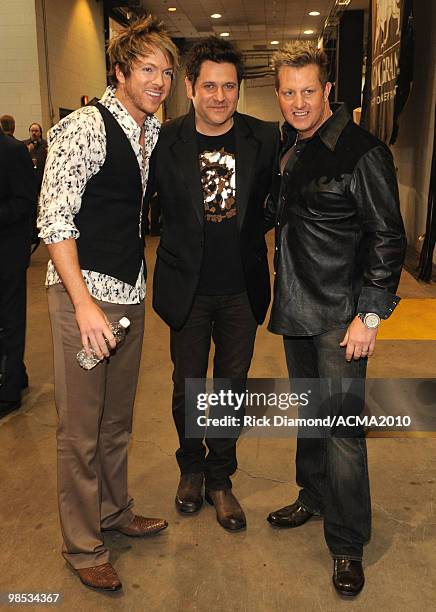 Musicians Joe Don Rooney, Jay DeMarcus and Gary LeVox of the band Rascal Flatts backstage at the 45th Annual Academy of Country Music Awards at the...