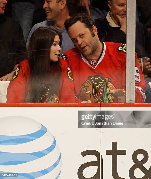 Actor Vince Vaughn and his wife Kyla Weber chat as they watch the Chicago Blackhawks take on the Nashville Predators in Game Two of the Western...