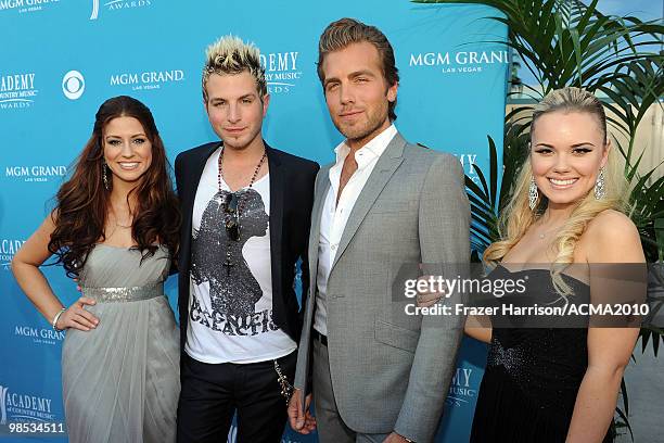 Singers Rachel Reinert, Mike Gossin, Tom Gossin, and Cheyenne Kimball of the band Gloriana arrive for the 45th Annual Academy of Country Music Awards...