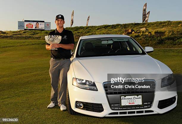 Kevin Chappell poses with the tournament trophy and his Audi A4 after winning the Fresh Express Classic at TPC Stonebrae on April 18, 2010 in...