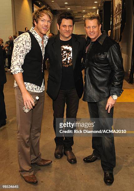 Musicians Joe Don Rooney, Jay DeMarcus and Gary LeVox of the band Rascal Flatts backstage at the 45th Annual Academy of Country Music Awards at the...