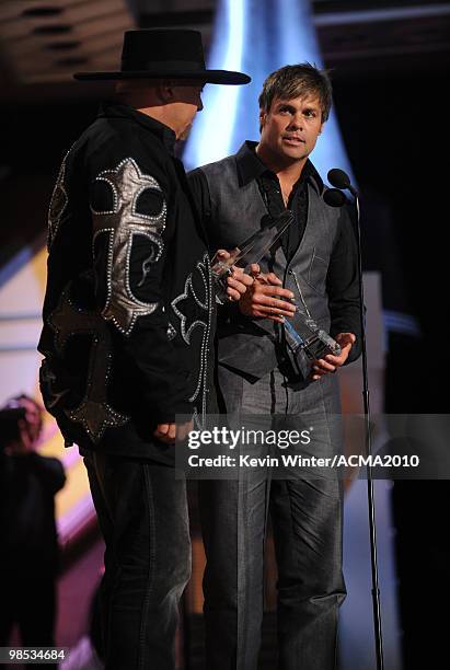 Musicians Eddie Montgomery and Troy Gentry accept the Home Depot Humanitarian award onstage during the 45th Annual Academy of Country Music Awards at...