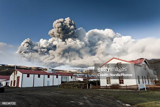 The farm of Olafur Eggertsson is seen as volcanic smoke and ash plumes on the horizon April 17, 2010 near Eyjafjallajokull, Iceland. A major eruption...