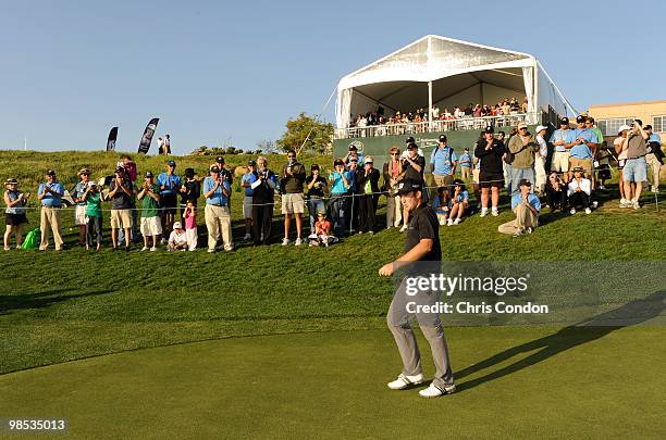 Kevin Chappell walks to the trophy ceremony as he is applauded by the gallery on after winning the Fresh Express Classic at TPC Stonebrae on April...