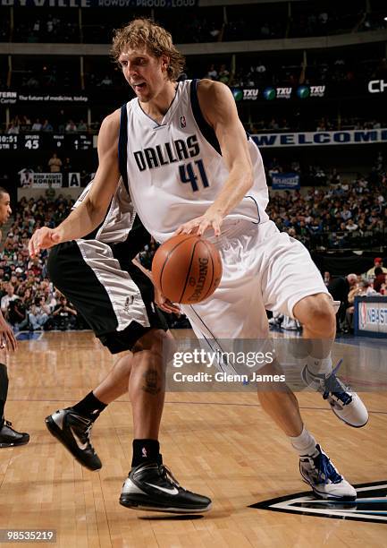 Dirk Nowitzki of the Dallas Mavericks spins to the baseline and drives against the San Antonio Spurs in Game One of the Western Conference...