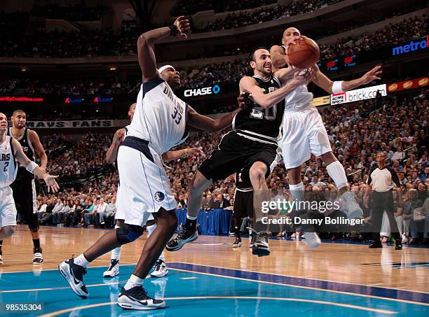 Manu Ginobili of the San Antonio Spurs has his shot blocked by Shawn Marion of the Dallas Mavericks in Game One of the Western Conference...